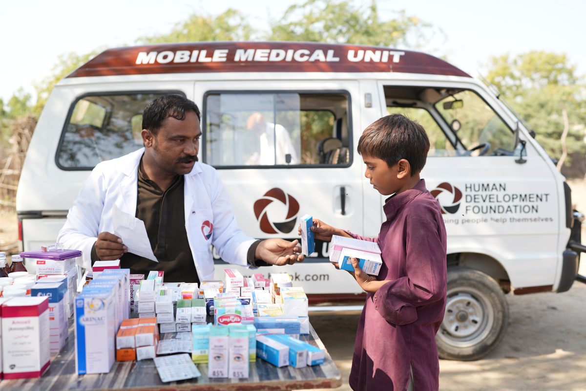 An HDF mobile medical unit visiting a village